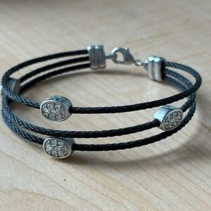 Black cord bracelet/ lobster clasp / silver tone/ measures size 7